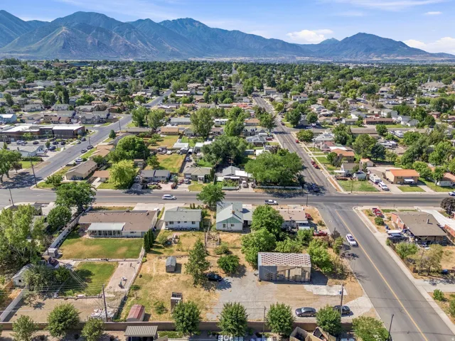 Aerial perspective of a residential neighborhood with distant mountains