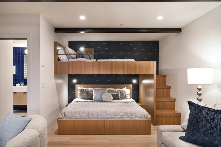 Custom built-in bunk bed system featuring wood-finish construction and integrated lighting