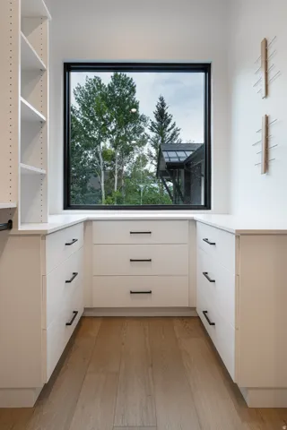 Built-in cabinetry with white flat-panel doors and matte black hardware