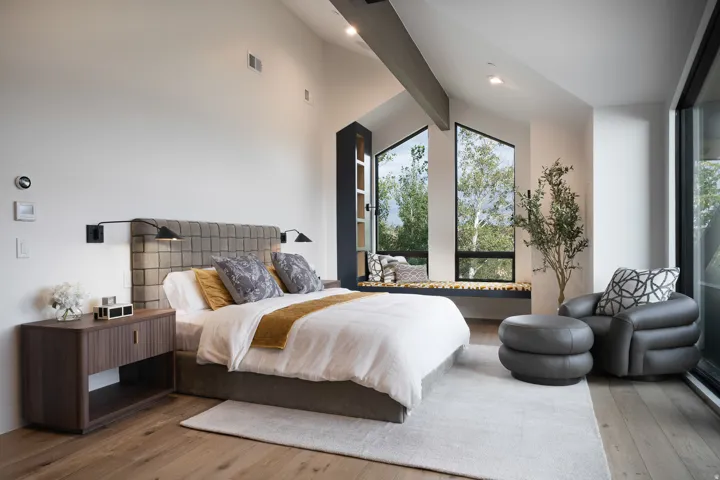 Hardwood-finish flooring, high vaulted ceilings, large picture windows, built-in window seating, and built-in shelving