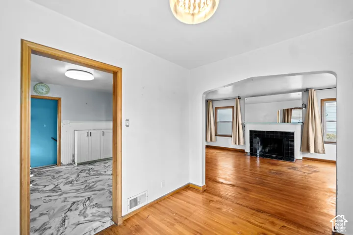 Looking from the dining room to the kitchen (left) and living room.