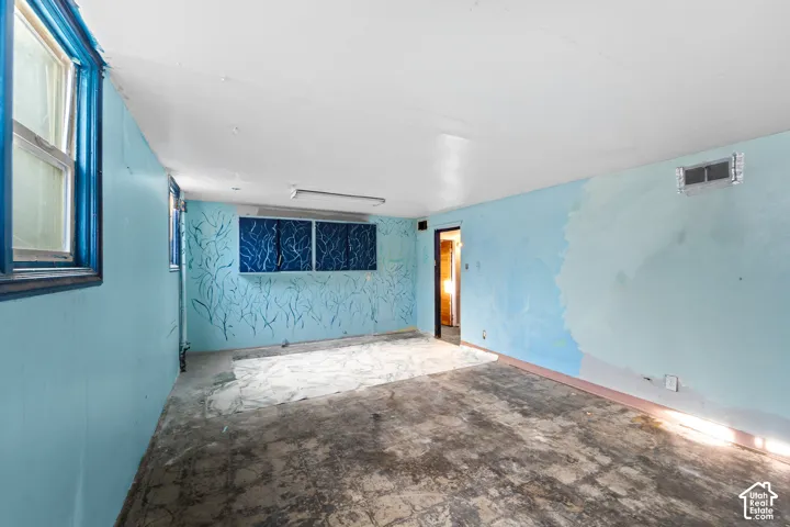 The basement ceilings are nice and high and this room has some plumbing for a future kitchenette.