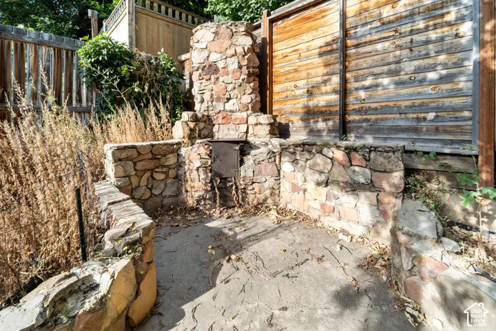 This cute fire place is located in the north west corner of the back yard. Enjoy wonderful summer memories toasting marshmallows here!
