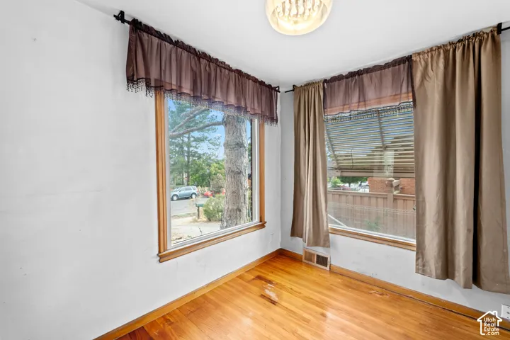 The dining room offers lots of natural light and a beautiful arch detail.