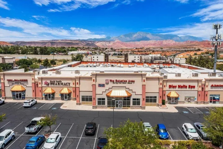 Retail center featuring multiple storefronts with distinct signage and awnings