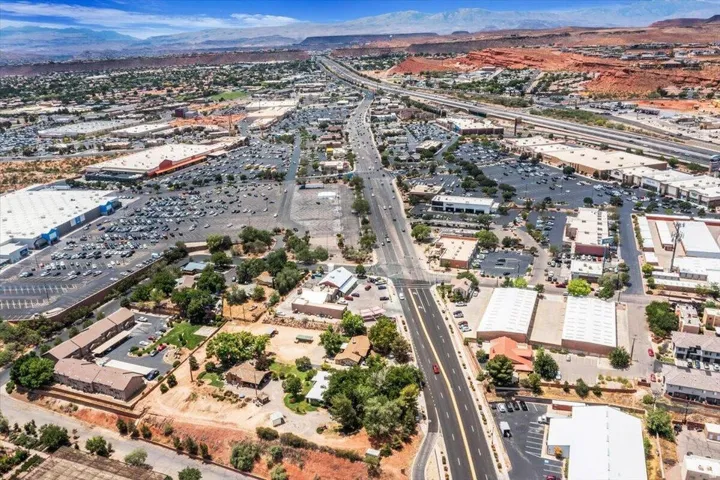 Extensive commercial and residential development featuring multiple retail centers, a major highway, and diverse building types
