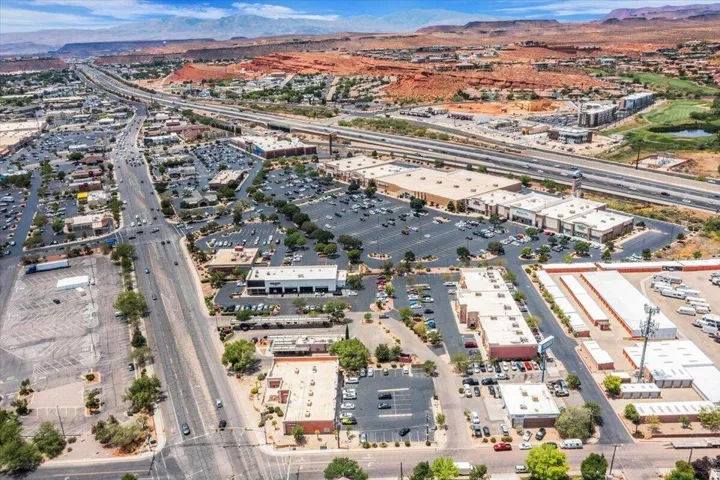 Expansive commercial district featuring multiple retail buildings and extensive parking areas