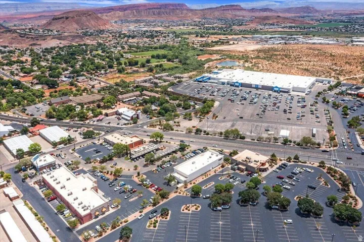 Aerial perspective featuring commercial properties with ample parking