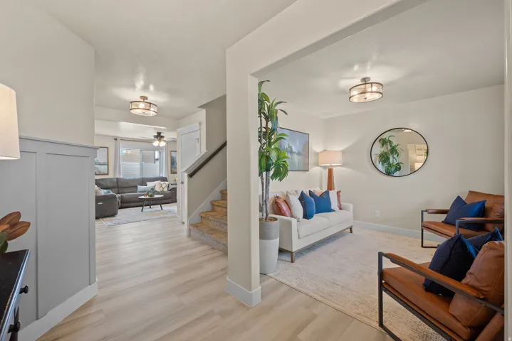 Light wood-finish flooring extending through an open-concept interior