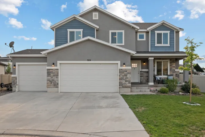 Contemporary two-story exterior with stucco siding and stone accents