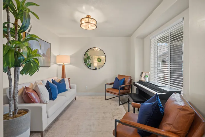 Recessed window with horizontal blinds, light-toned wall paint, and a built-in overhead light fixture