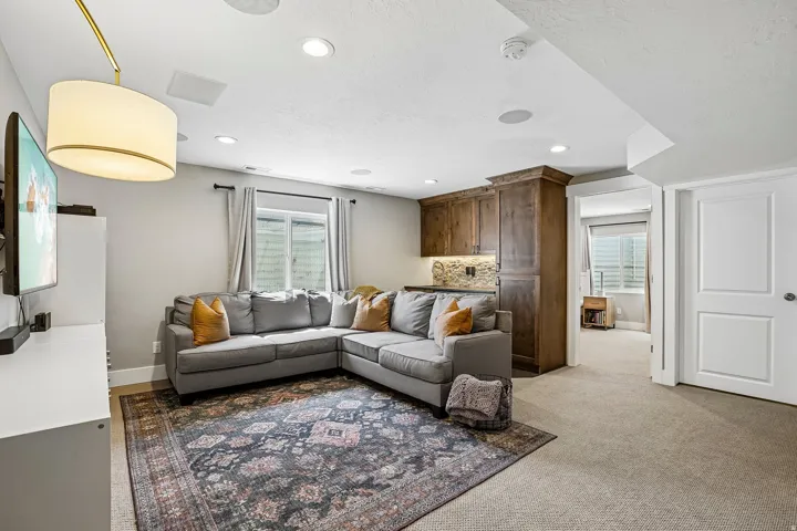 Recreational room featuring recessed lighting and integrated audio speakers