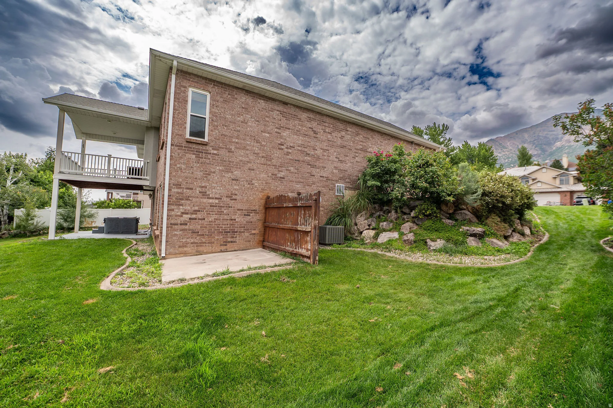 Expansive green lawn bordering a brick exterior