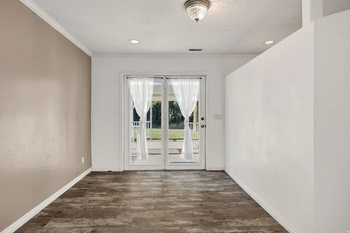 Glass paneled double doors with sheer white curtains