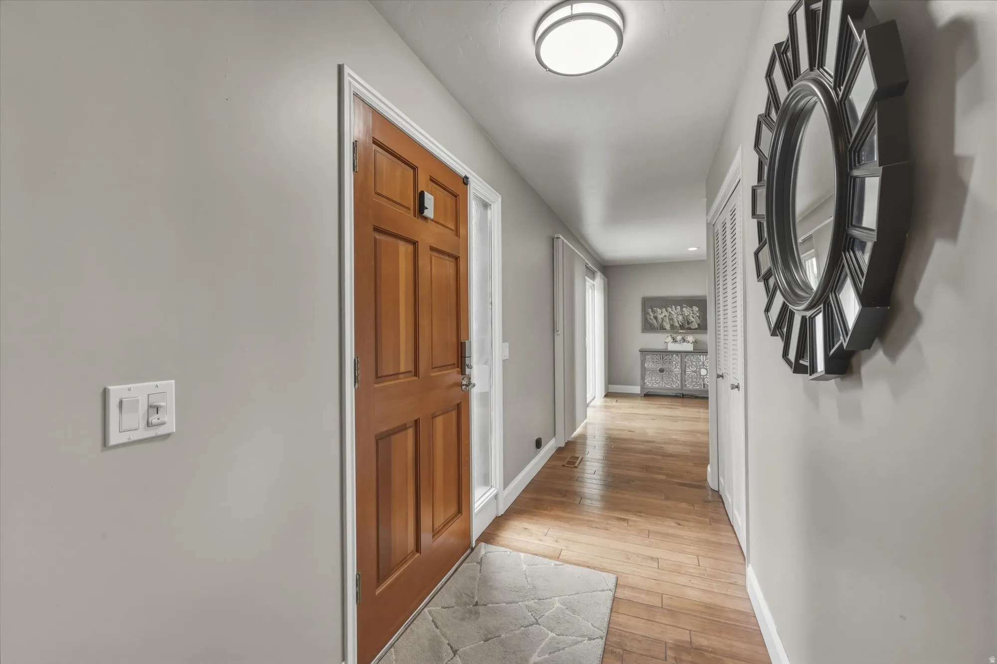 Light gray painted walls complementing wood-finish flooring