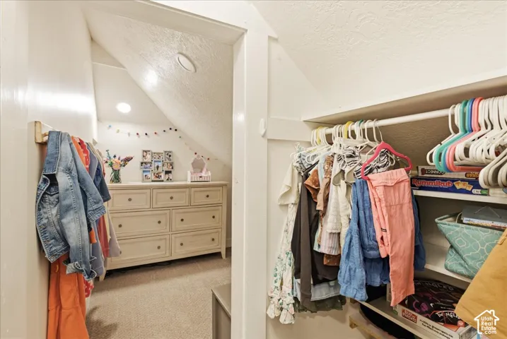 Built-in closet system with shelving and hanging rods