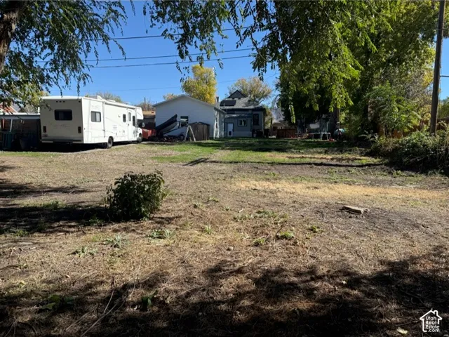 Expansive lot featuring mature deciduous trees and natural landscaping