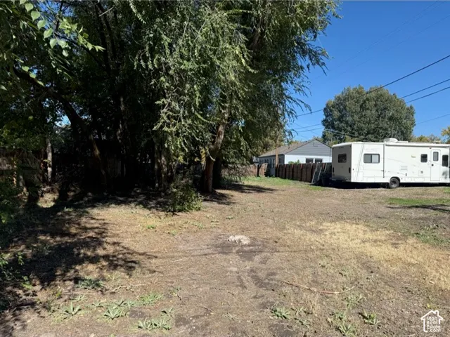 Expansive lot featuring mature trees and established fencing