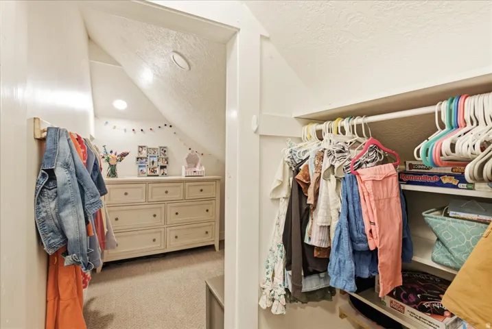 Built-in closet system with shelving and hanging rods