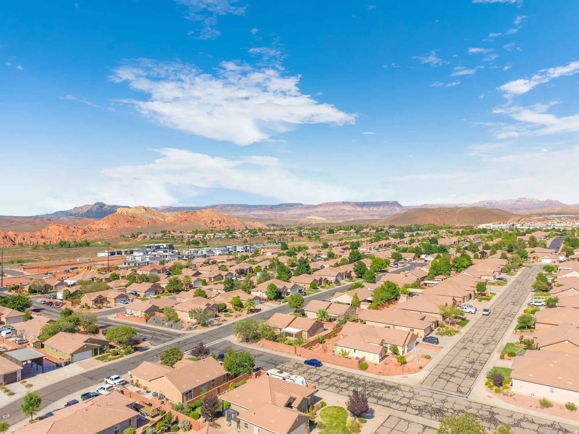 Residential neighborhood featuring an expansive collection of single-story homes, mature landscaping, and paved streets