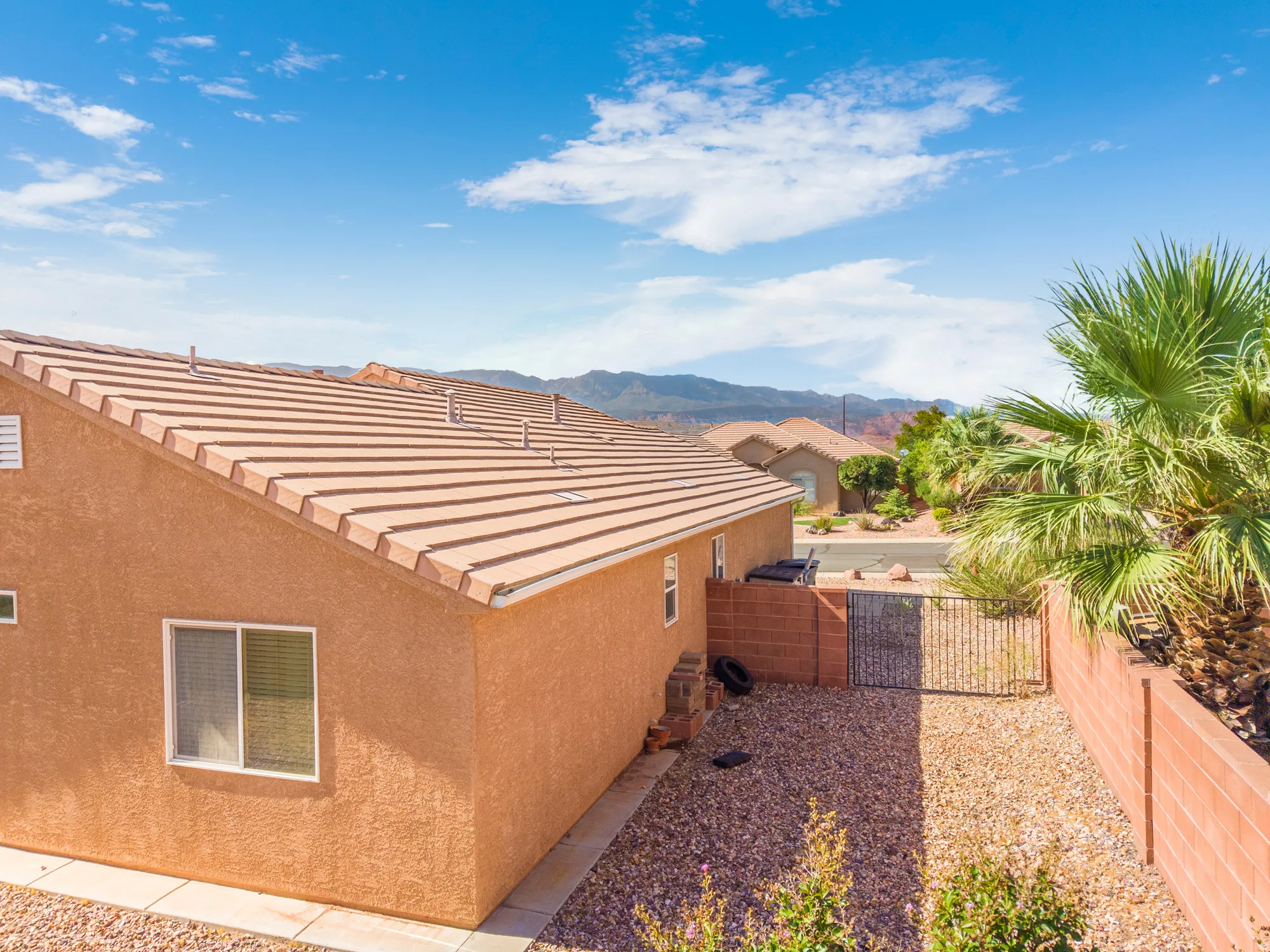 Exterior stucco finish with a tiled roof