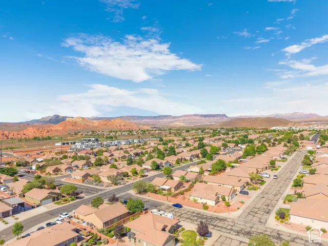 Residential neighborhood featuring an expansive collection of single-story homes, mature landscaping, and paved streets