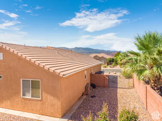 Exterior stucco finish with a tiled roof