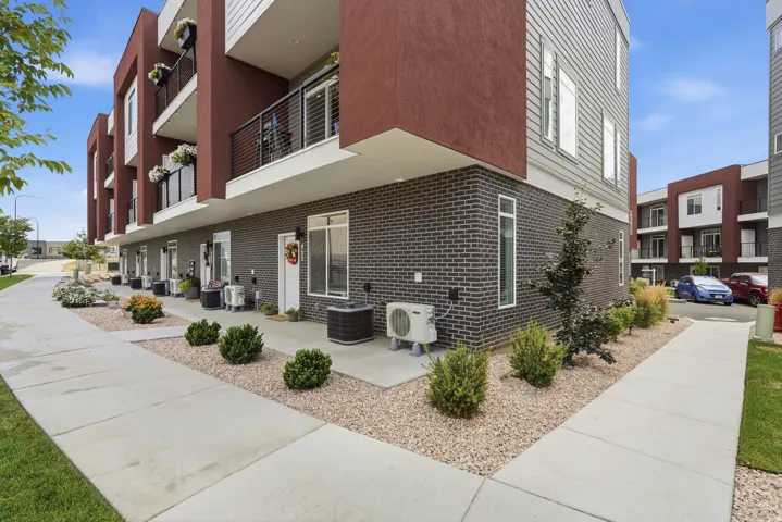 Multi-level exterior featuring dark brick and horizontal siding