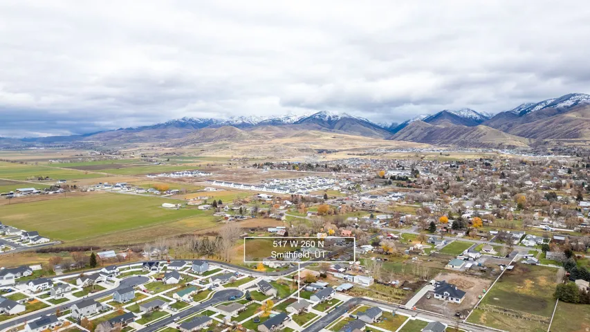 Expansive aerial perspective showcasing a developed residential area with numerous single-family homes