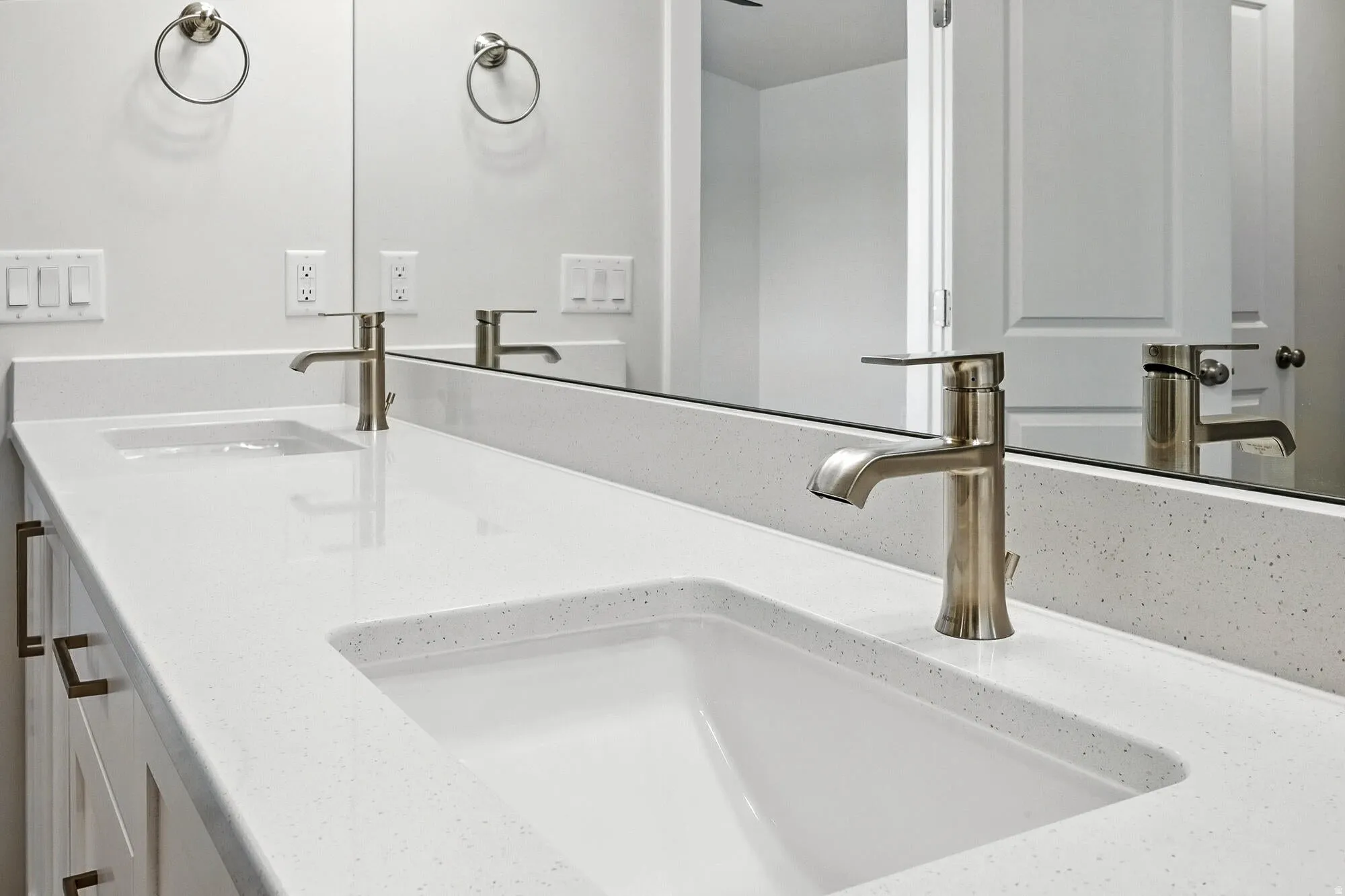 Double vanity featuring an integrated countertop and two undermount sinks