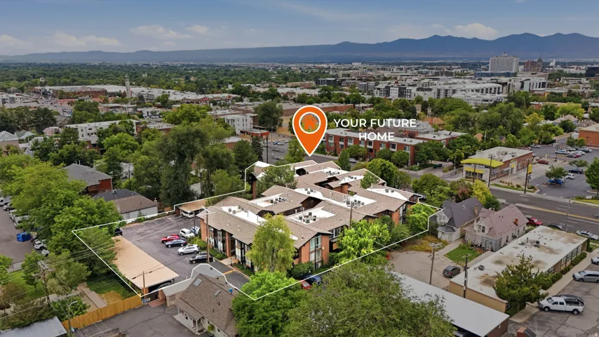 Multi-unit property with a brick exterior, multiple covered parking spaces, and mature landscaping