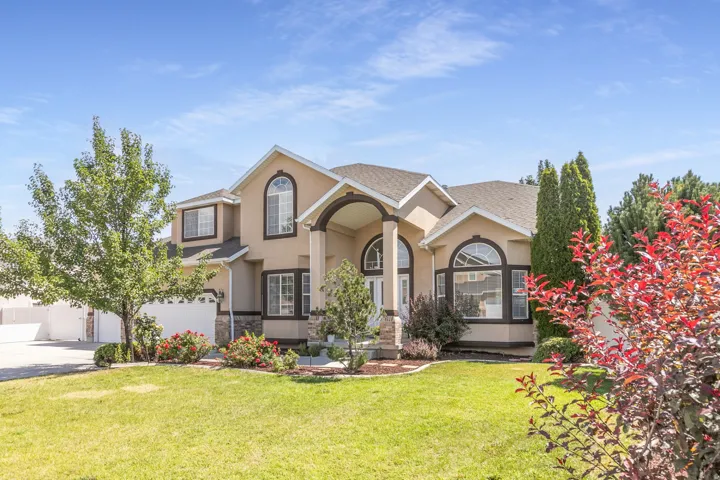 Stucco exterior with stone accents and arched windows