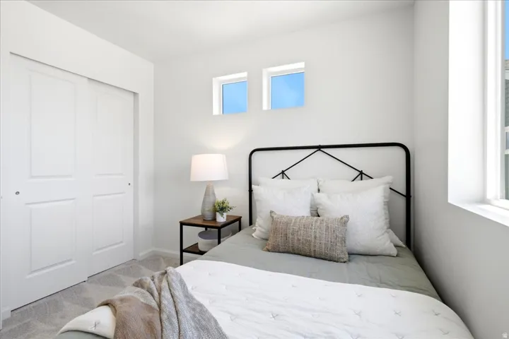Bright room featuring a large window, two transom windows, and white walls