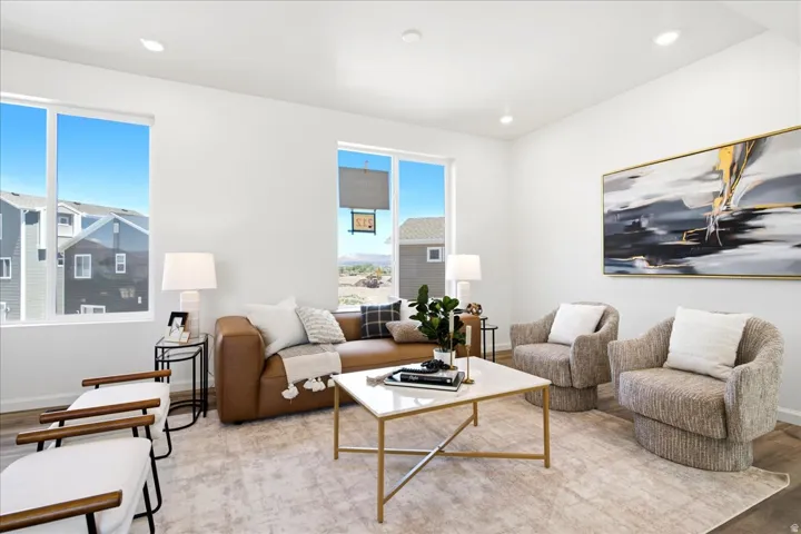 Living area featuring recessed lighting and wood-finish flooring