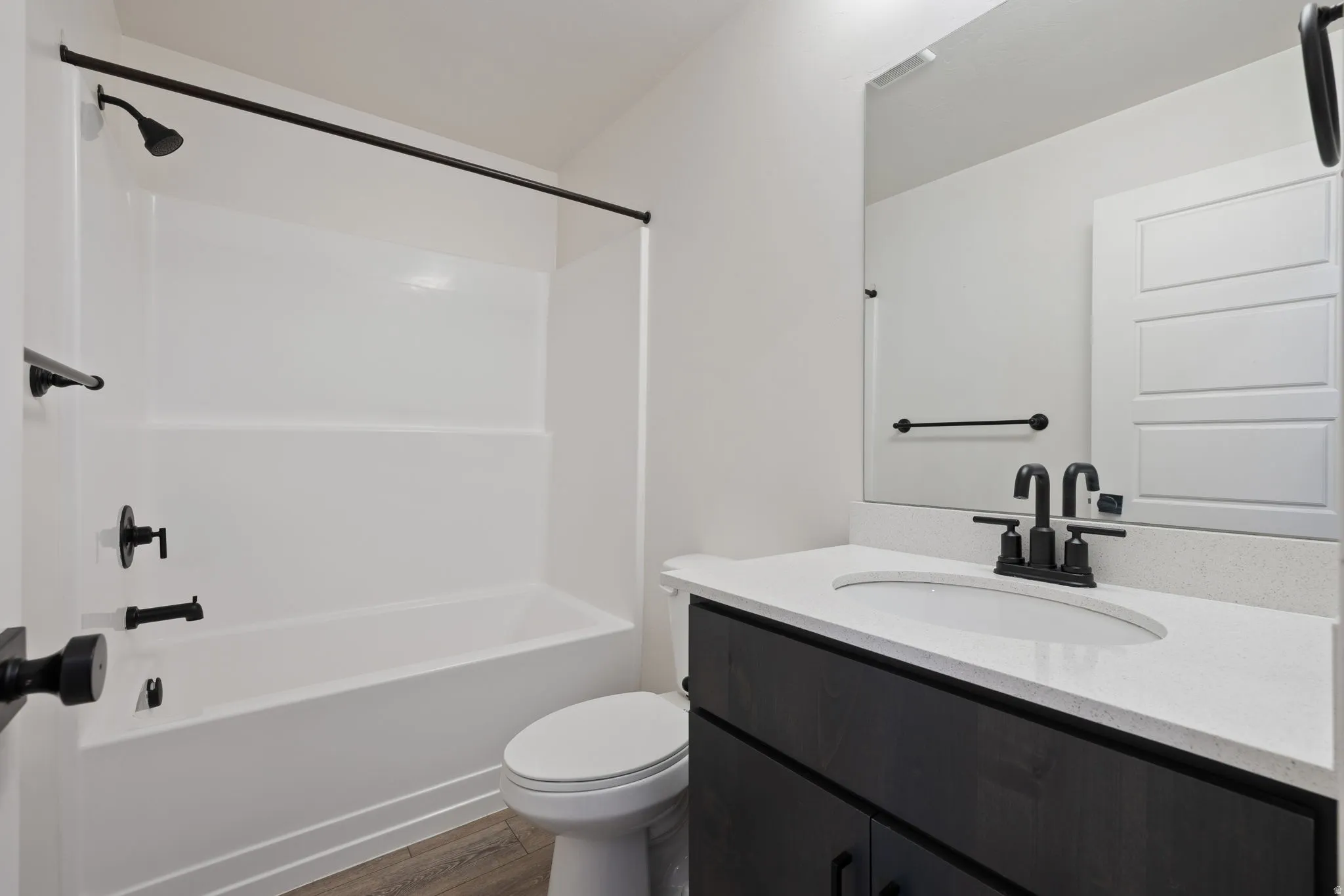 Bathroom vanity with a white countertop and undermount sink