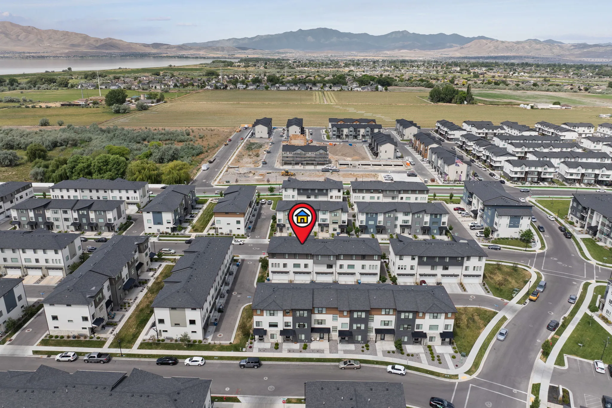 Contemporary townhome community featuring diverse architectural styles and dark-tone shingle roofs