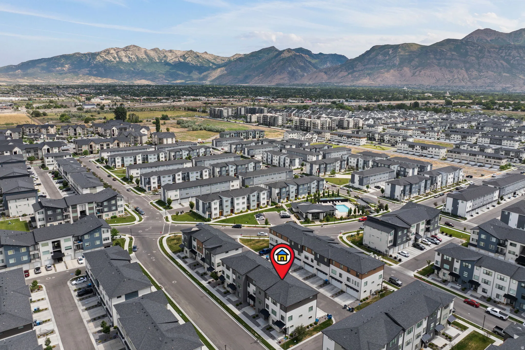 Aerial perspective showcasing a community of multi-story residential buildings with diverse architectural styles