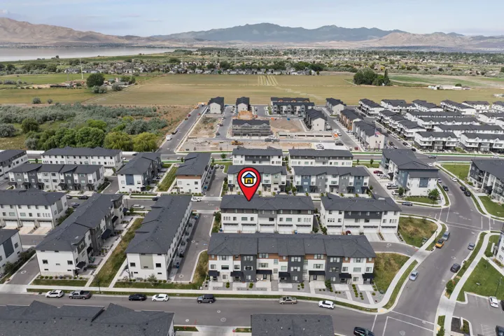 Contemporary townhome community featuring diverse architectural styles and dark-tone shingle roofs