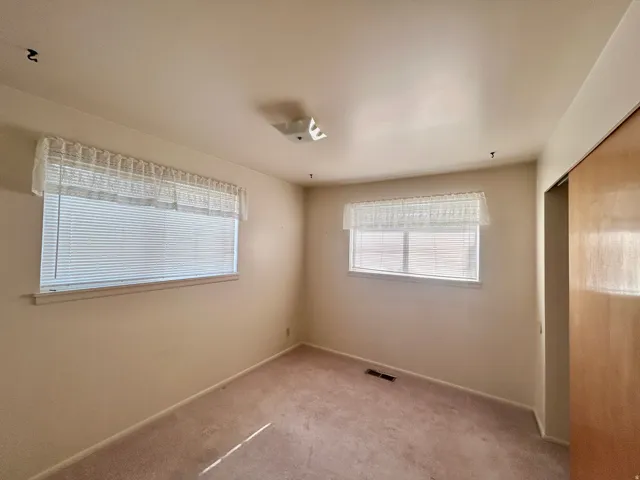 Second bedroom with two corner windows
