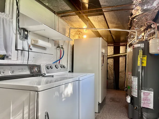 Utility room with washer/dryer/freezer included, plus two water heaters and two furnaces
