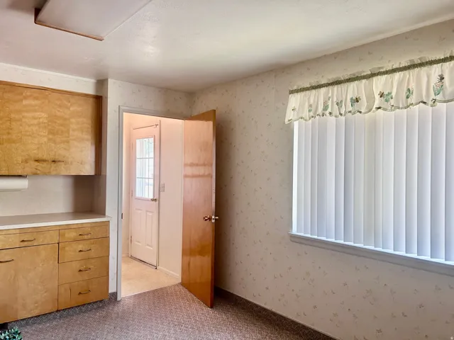 Side door entrance which also leads to the shared utility room downstairs