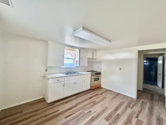 Newer laminate flooring in the basement kitchen
