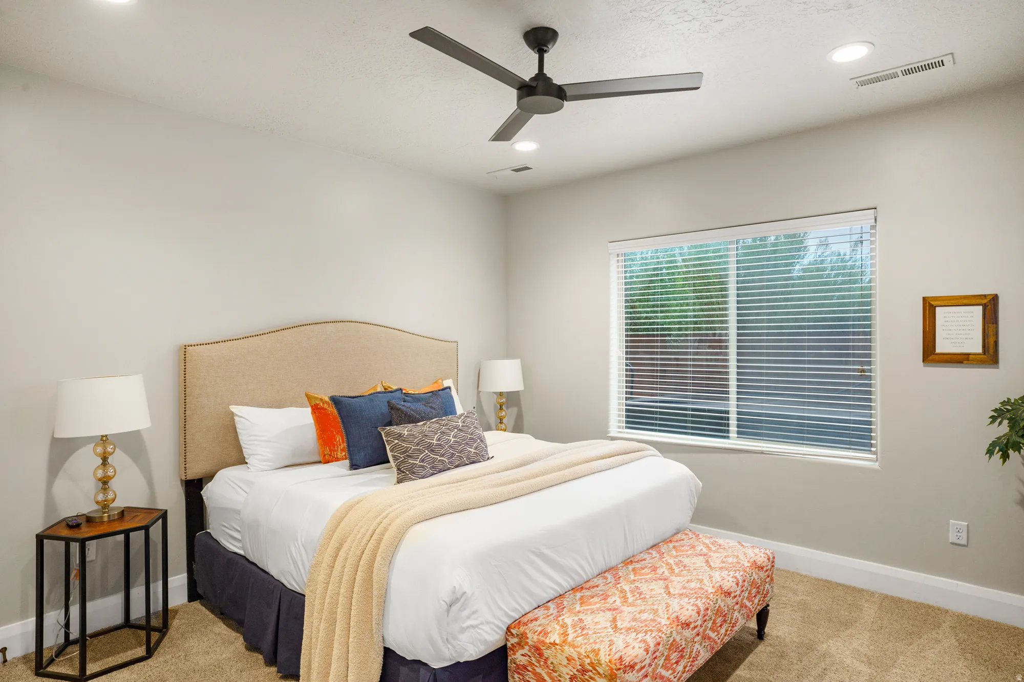 Bedroom featuring a neutral color palette, ceiling fan with integrated lighting, recessed lighting, and a large window with horizontal blinds