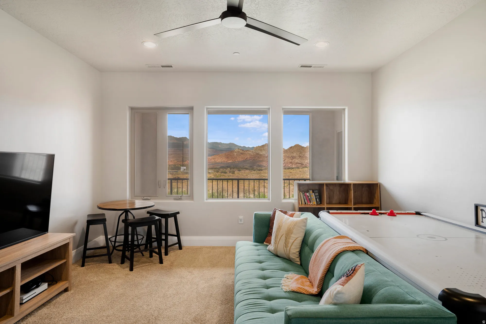 Room featuring a modern ceiling fan with integrated lighting, recessed lighting, and carpet flooring