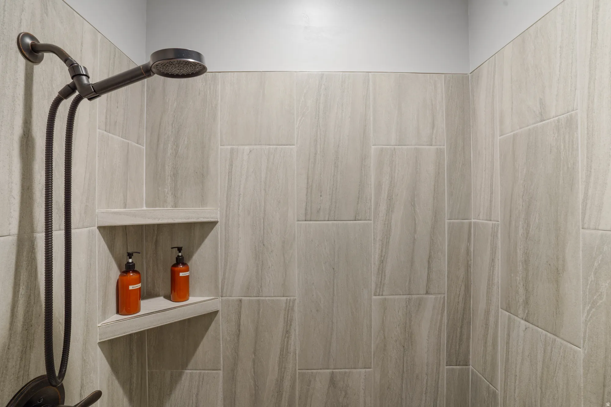 Shower stall with full-height large format tile surround