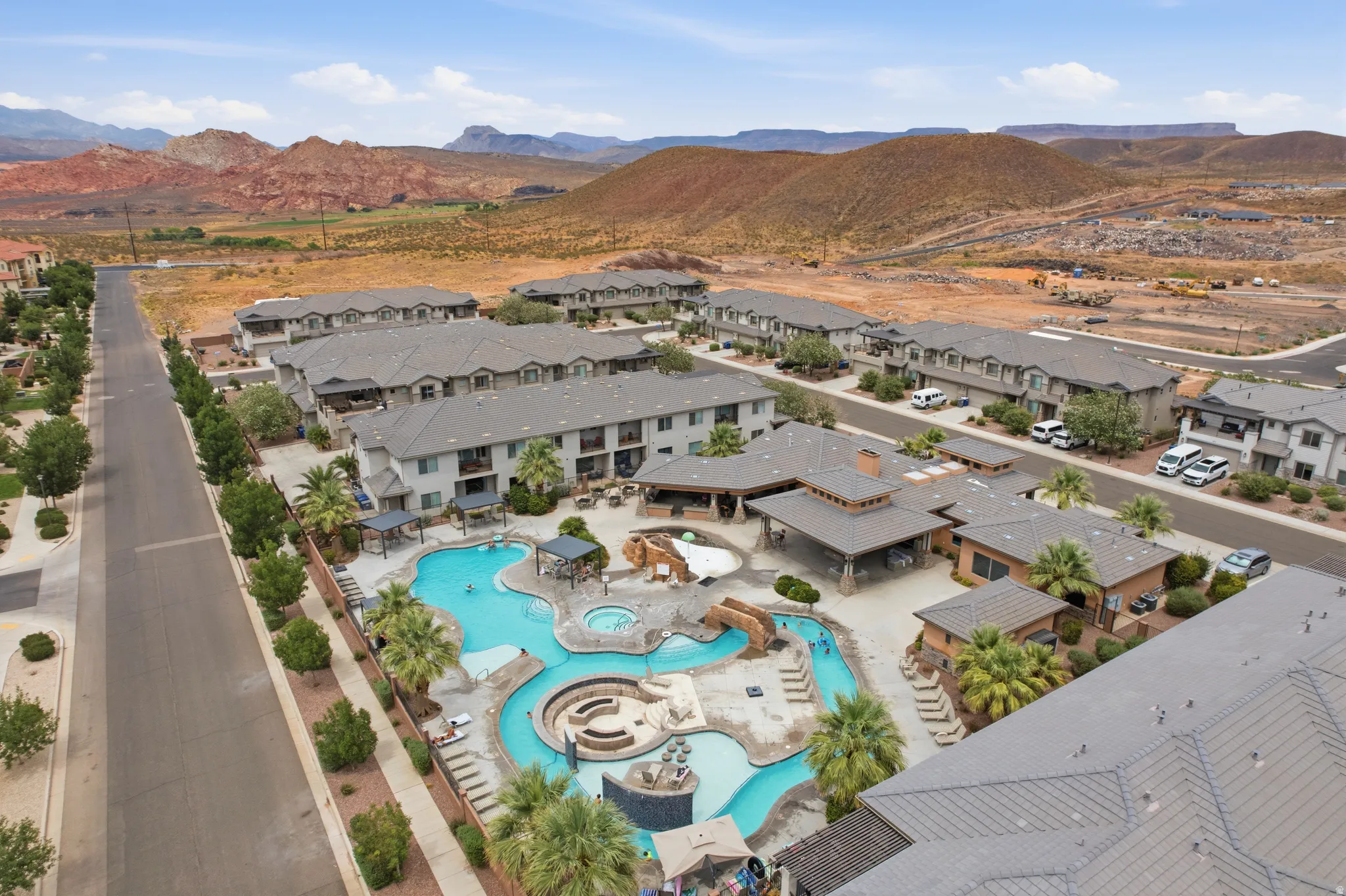 Community amenities featuring a multi-level swimming pool, a meandering lazy river, and a dedicated spa area