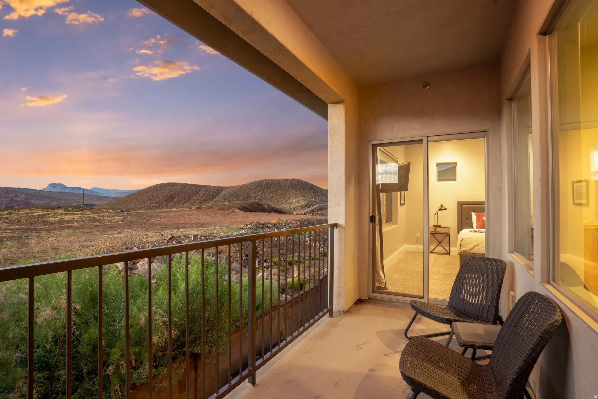 Private balcony with desert landscape and distant mountains