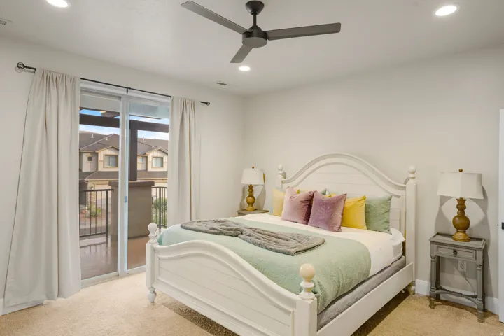 Bedroom featuring a sliding glass door to an exterior balcony, recessed lighting, and a ceiling fan