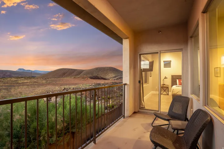 Private balcony with desert landscape and distant mountains