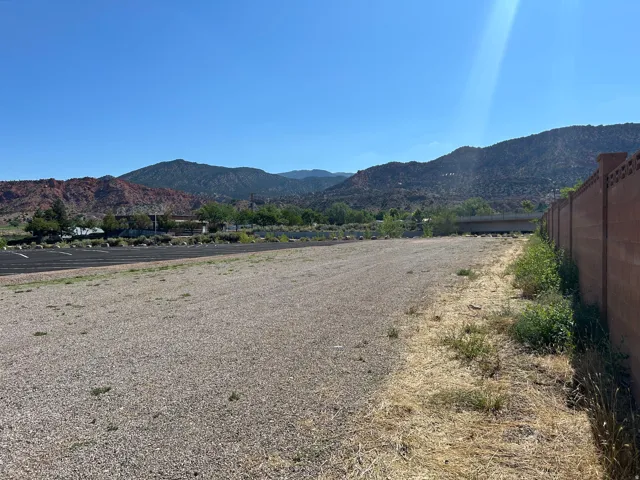 Expansive gravel lot with a segmented paved area